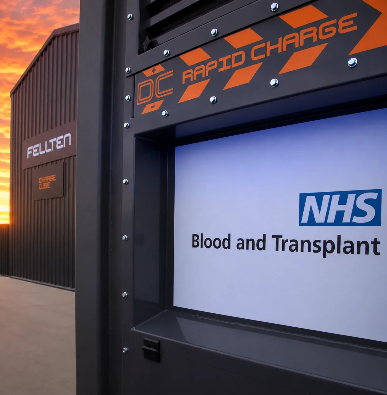 Close view of a CQ450 rapid charge DC panel carrying NHS Blood and Transplant branding
